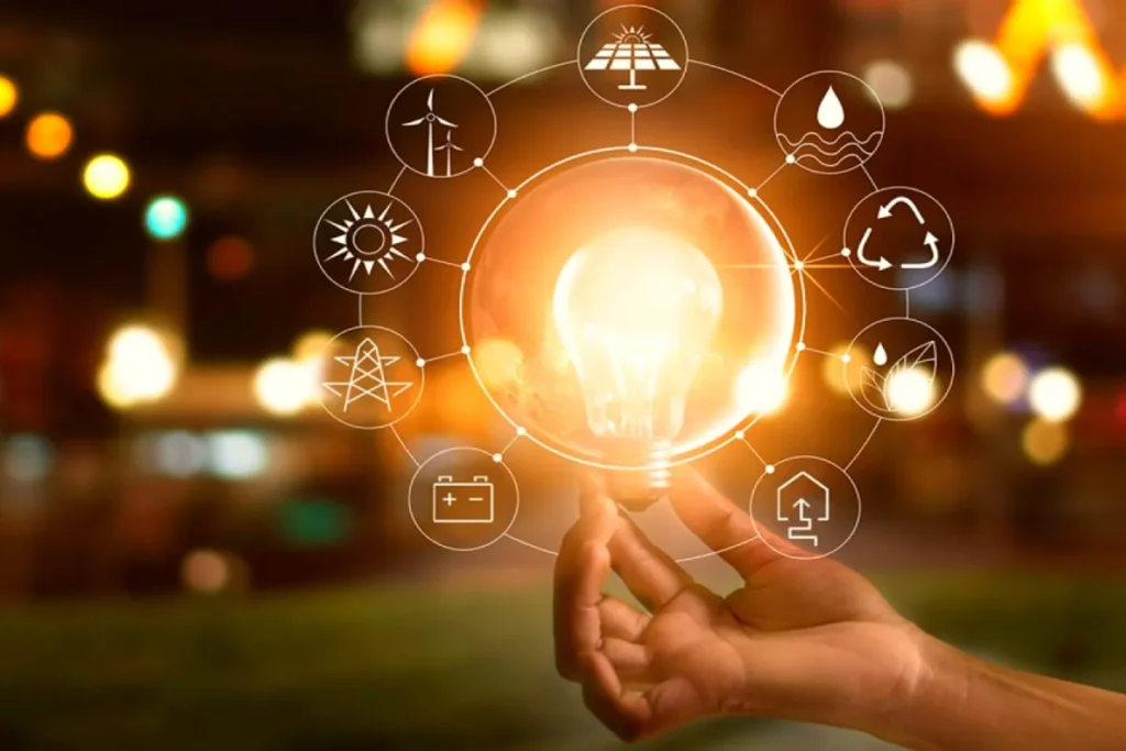 Mão segurando uma lâmpada acesa, cercada por ícones de energia renovável, reciclagem e soluções sustentáveis, simbolizando a economia criativa.